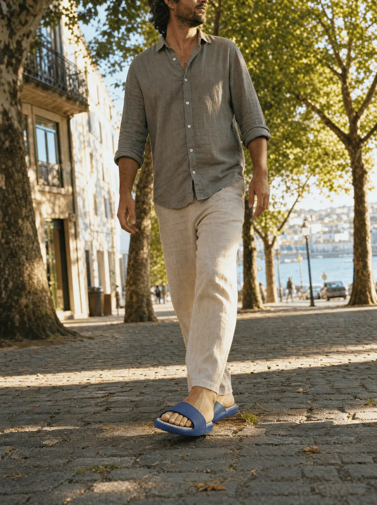 Zenith Steelwater reflexology slides worn mid-step, showing the footbed