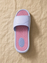 Close-up of the Zenith reflexology footbed in Crestfall — acupressure nodules across the sole