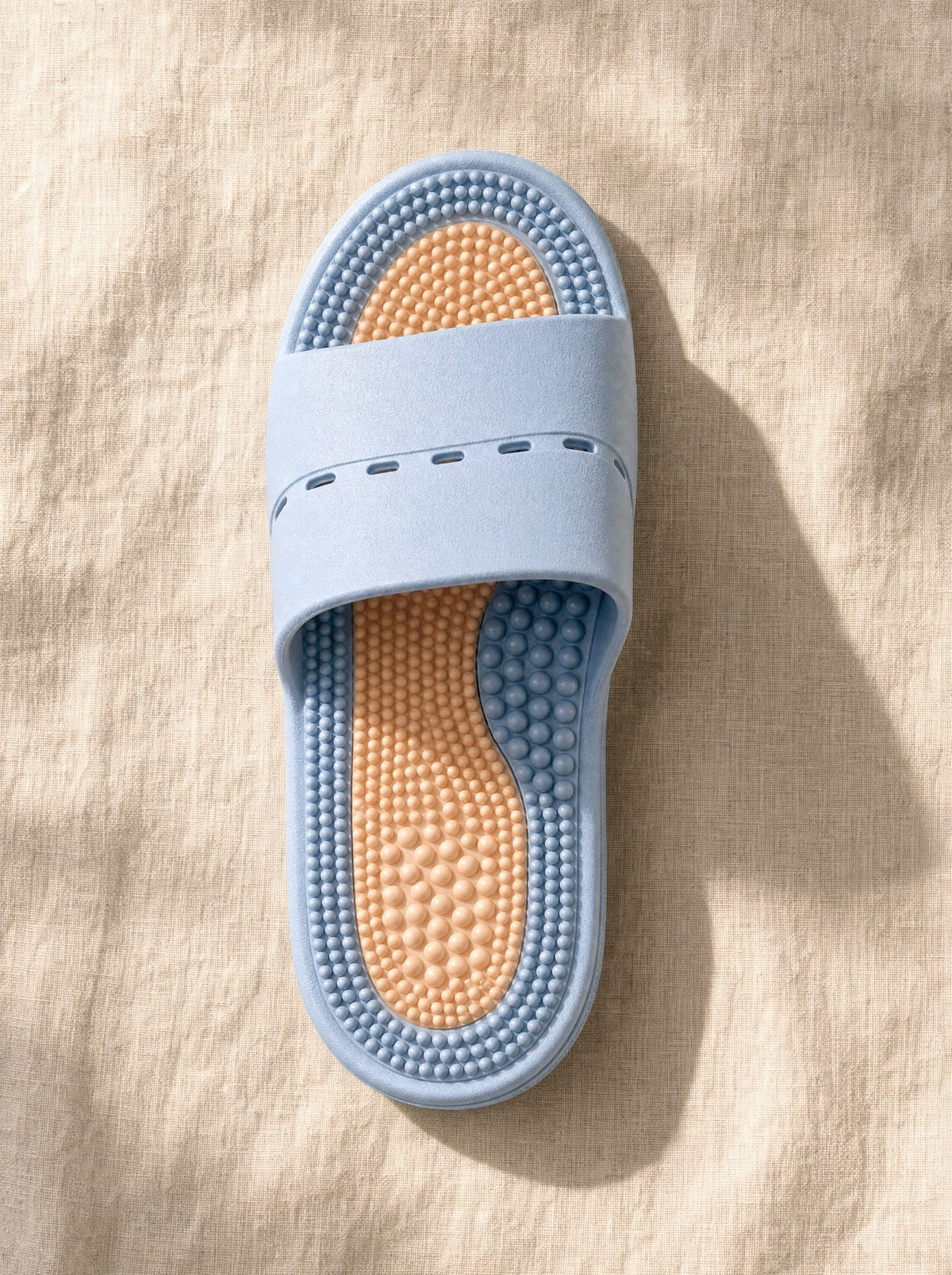 Close-up of the Meridian reflexology footbed in Dusk Shore — acupressure nodules across the sole