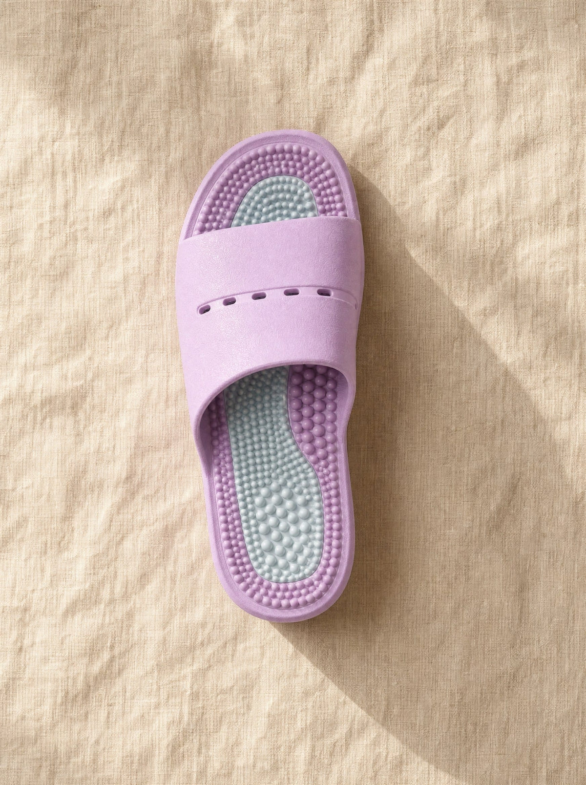 Close-up of the Meridian reflexology footbed in Nocturne — acupressure nodules across the sole